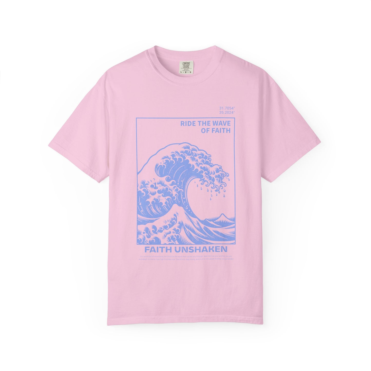 T-shirt with blue ocean wave design featuring 'Ride The Wave Of Faith' and 'Faith Unshaken' text