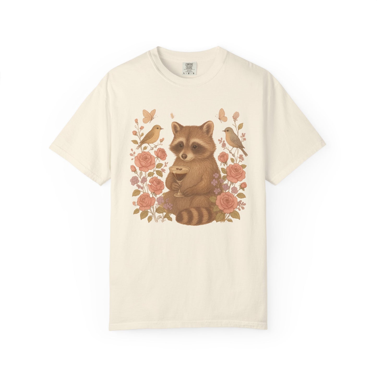T-shirt with raccoon holding espresso martini glass surrounded by pink roses and birds