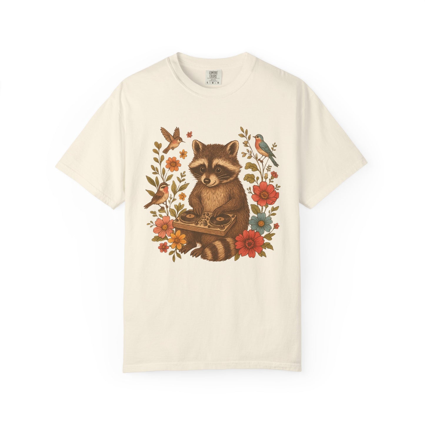 T-shirt with vintage raccoon DJ design surrounded by coral flowers, yellow blooms, and songbirds