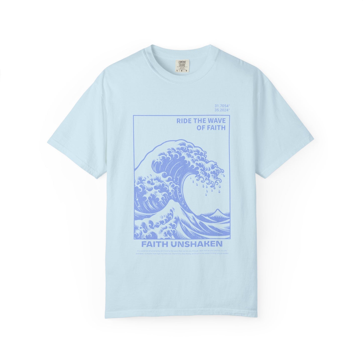 T-shirt with blue ocean wave design featuring 'Ride The Wave Of Faith' and 'Faith Unshaken' text