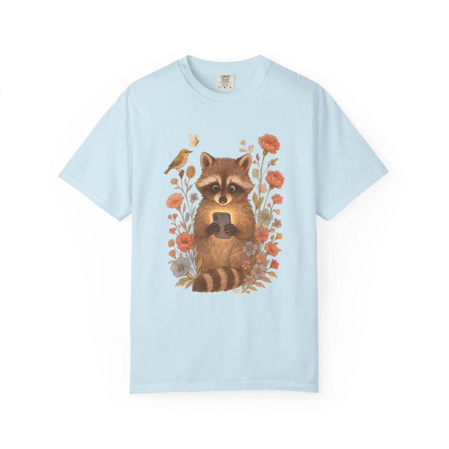 T-shirt with cute raccoon holding smartphone surrounded by coral and blue wildflowers