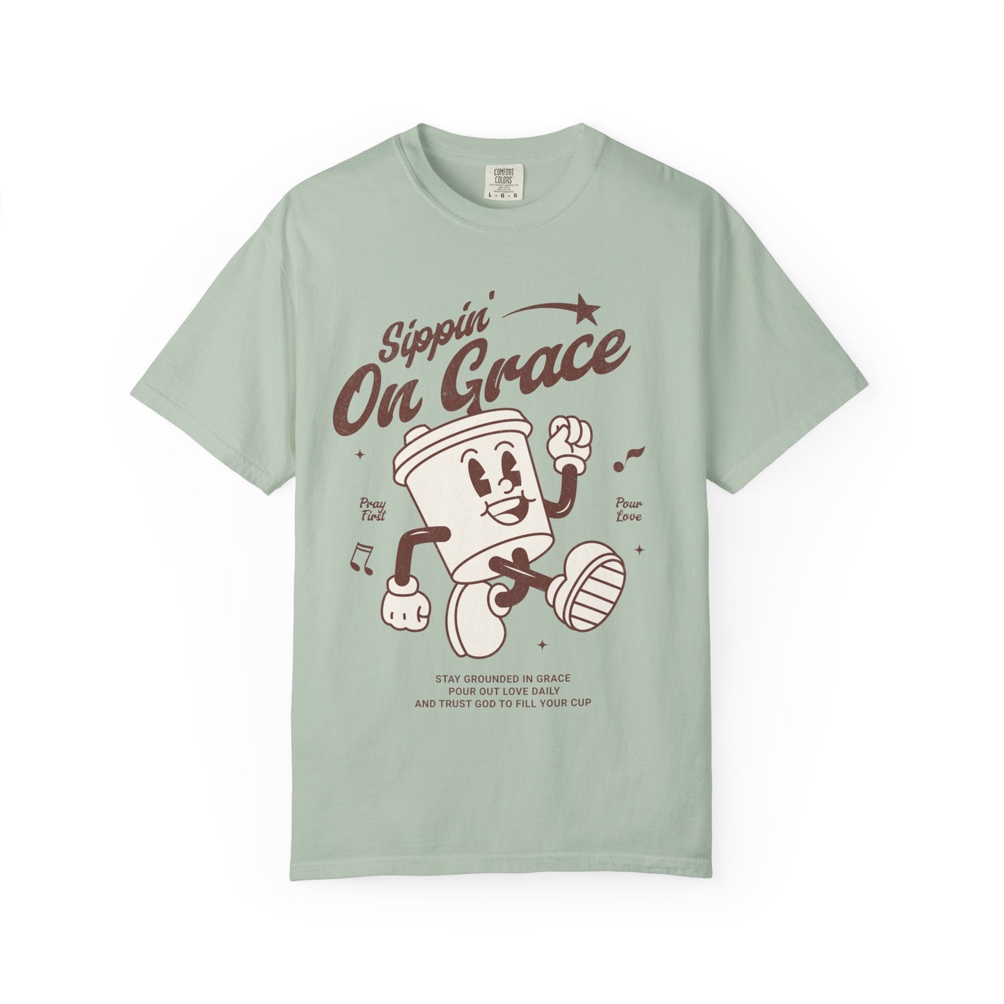 Christian t-shirt with cartoon coffee cup character and 'Sippin' On Grace' text in brown design