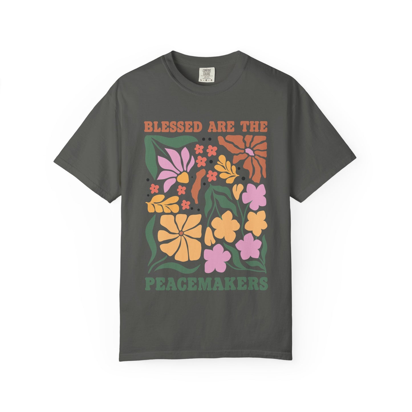 T-shirt with 'Blessed Are The Peacemakers' text surrounded by colorful floral design in pink, coral, yellow and green