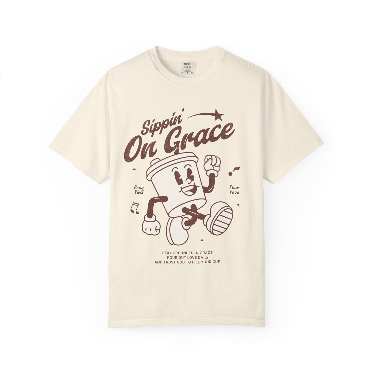 Christian t-shirt with cartoon coffee cup character and 'Sippin' On Grace' text in brown design