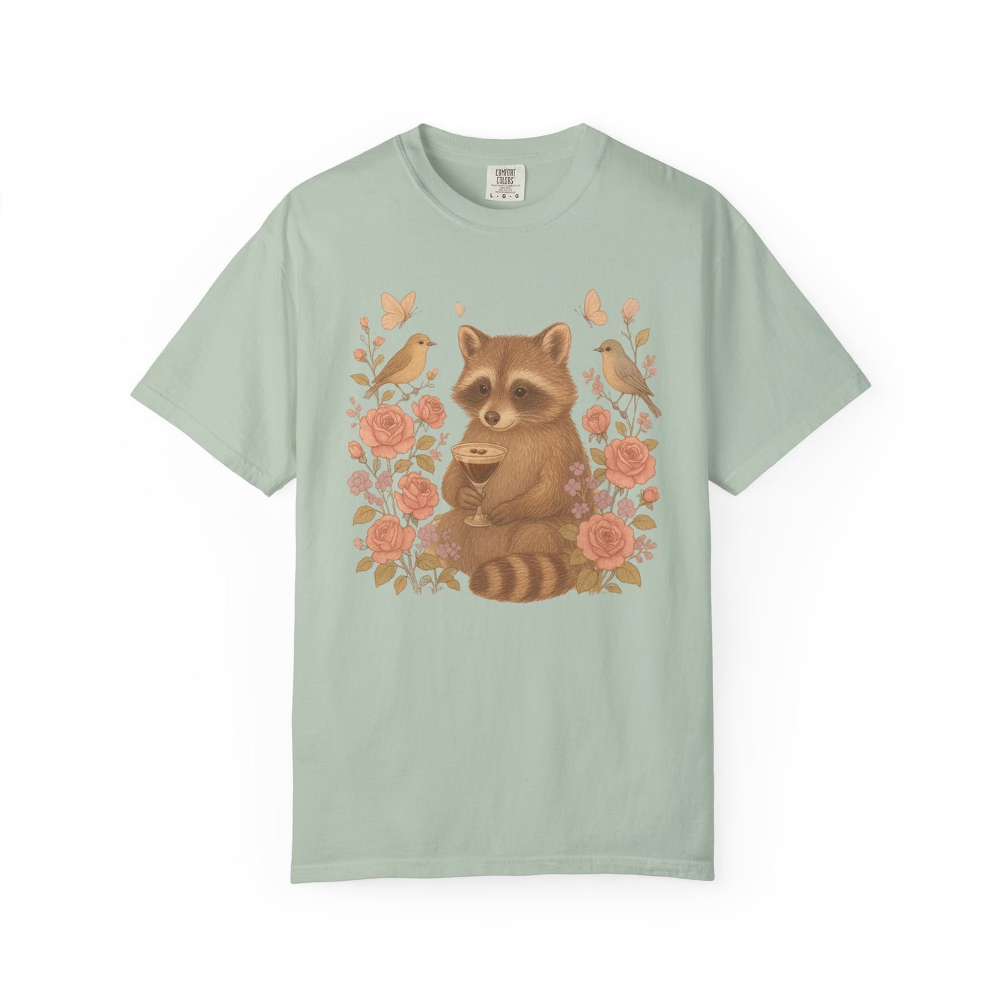 T-shirt with raccoon holding espresso martini glass surrounded by pink roses and birds