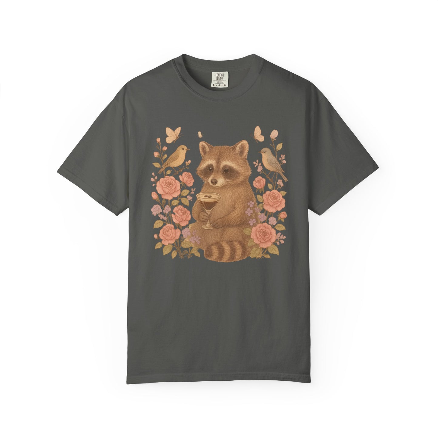 T-shirt with raccoon holding espresso martini glass surrounded by pink roses and birds