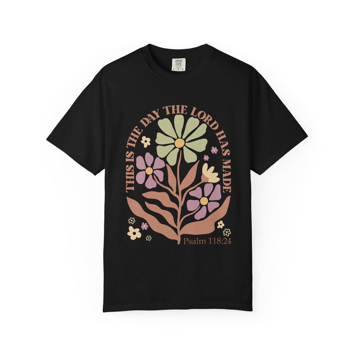 T-shirt with 'This is the Day' text, Psalm 118:24 verse, and floral design with protective hands in sage green, pink, and terracotta colors