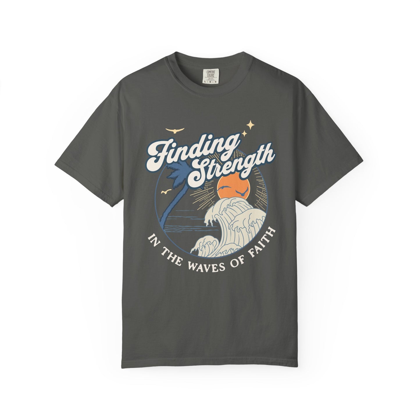 T-shirt with retro Christian design featuring palm tree, sunset, and ocean waves with Finding Strength text