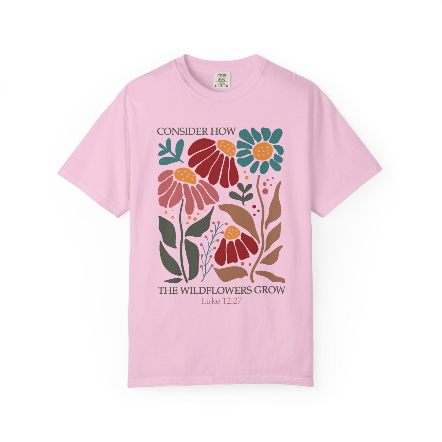 T-shirt with Luke 12:27 Bible verse and colorful wildflowers in red, pink, teal, and brown tones
