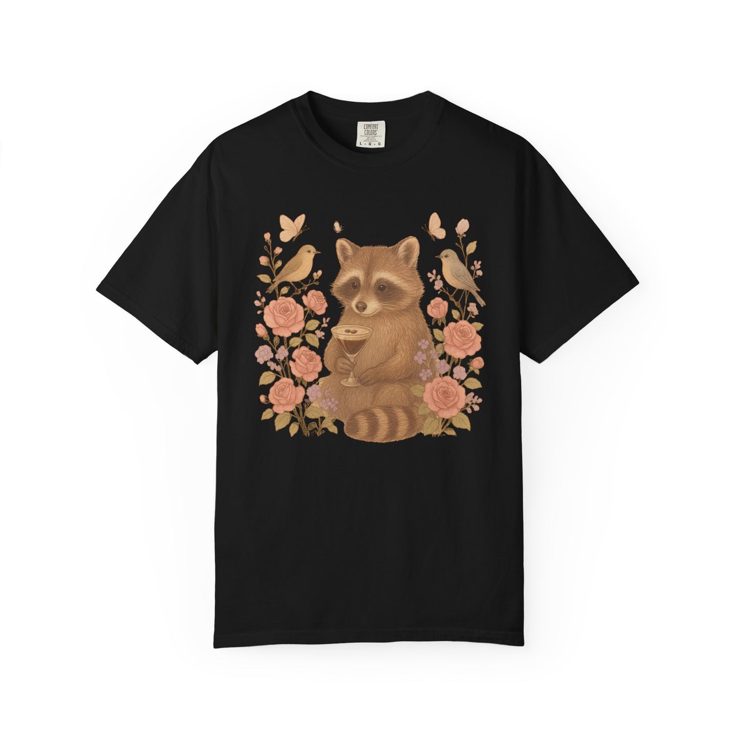 T-shirt with raccoon holding espresso martini glass surrounded by pink roses and birds