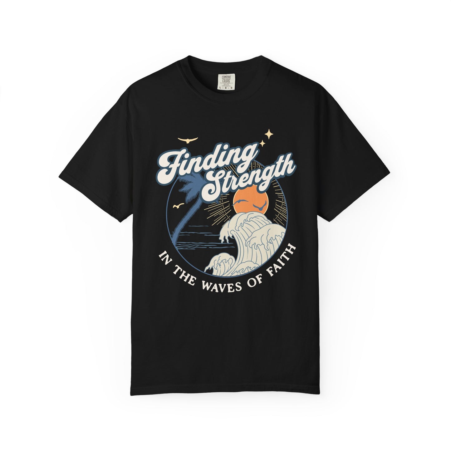 T-shirt with retro Christian design featuring palm tree, sunset, and ocean waves with Finding Strength text