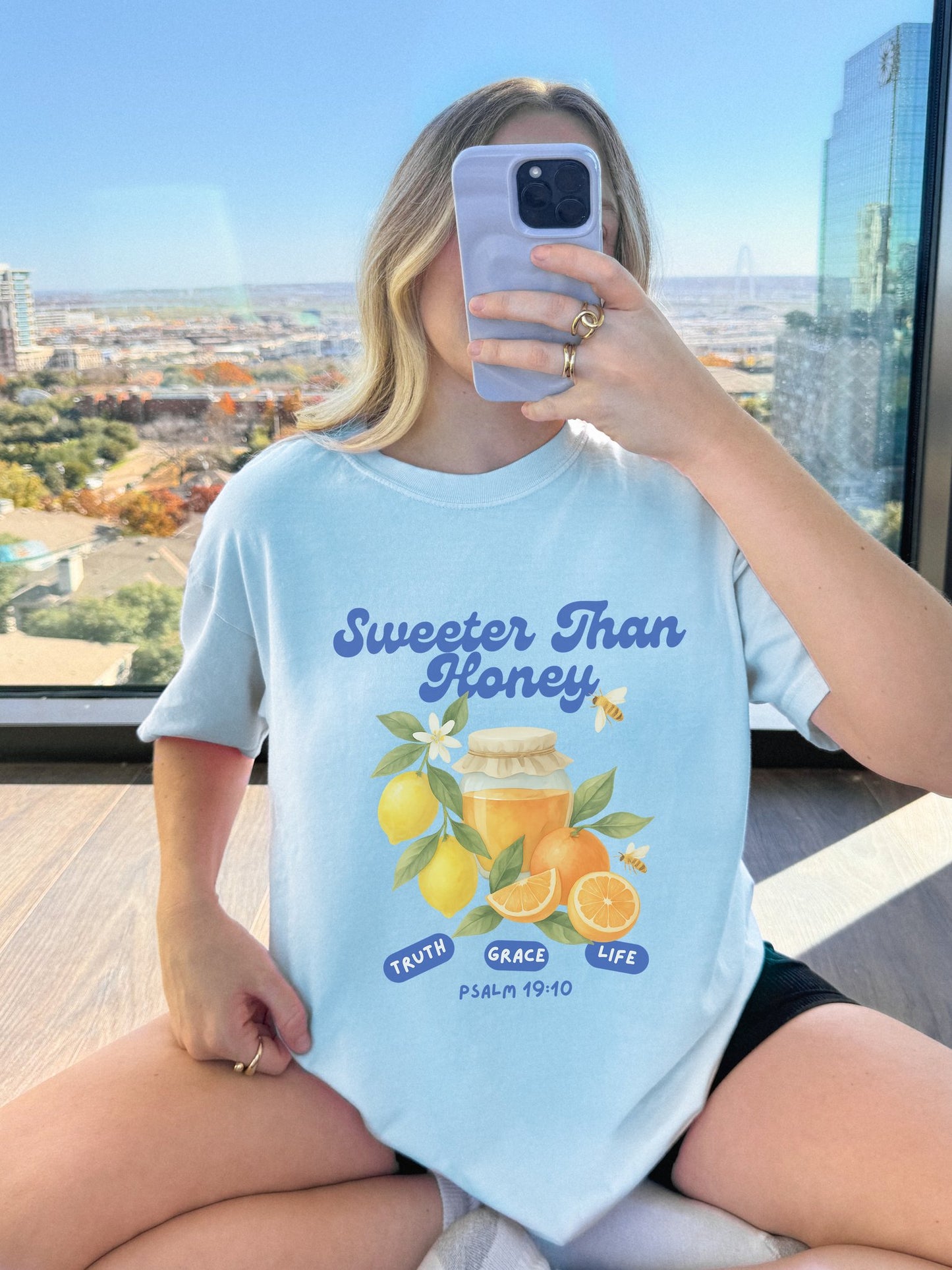Christian t-shirt with Sweeter Than Honey Psalm 19:10 design featuring watercolor honey jar, citrus fruits, and bees