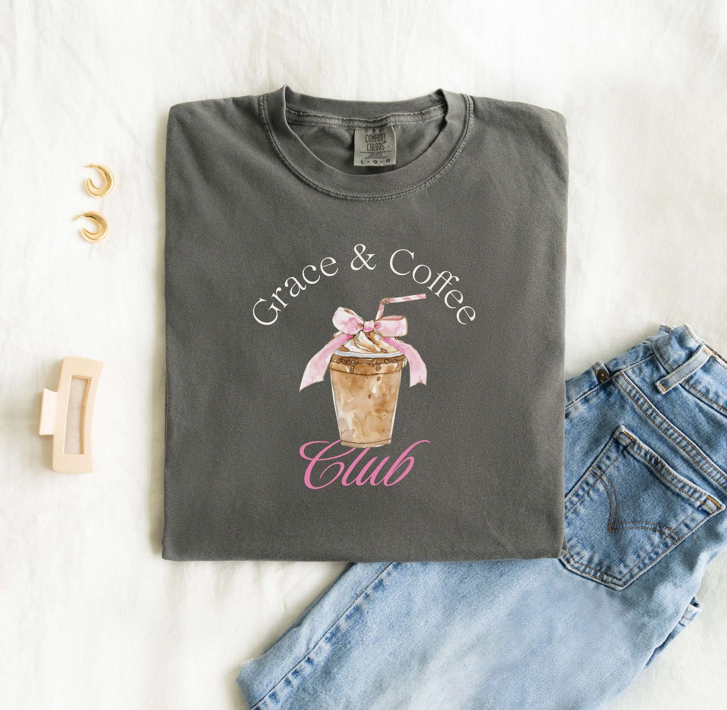 T-shirt with watercolor coffee cup design featuring pink bow and Grace & Coffee Club text