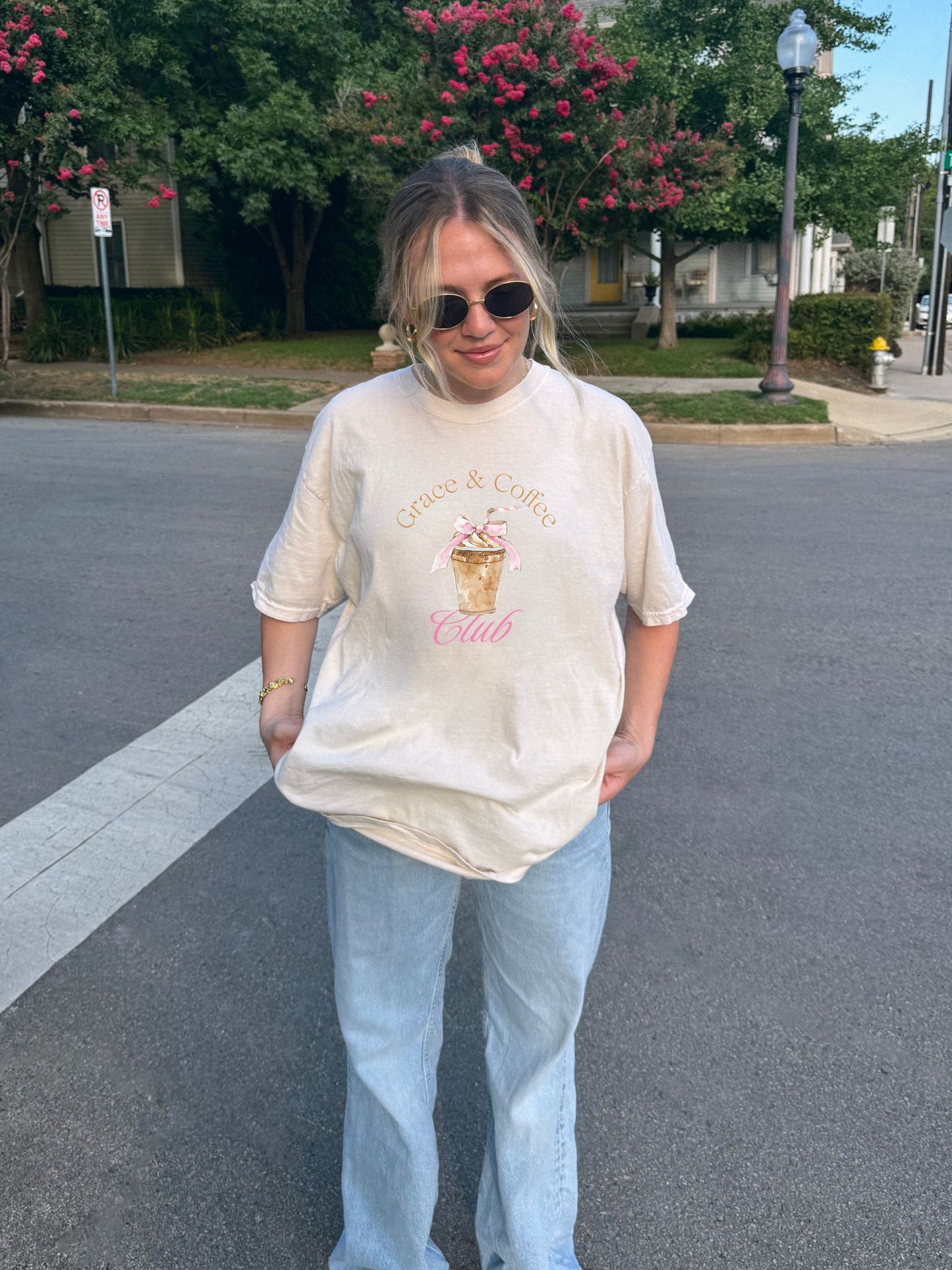 T-shirt with watercolor coffee cup design featuring pink bow and Grace & Coffee Club text