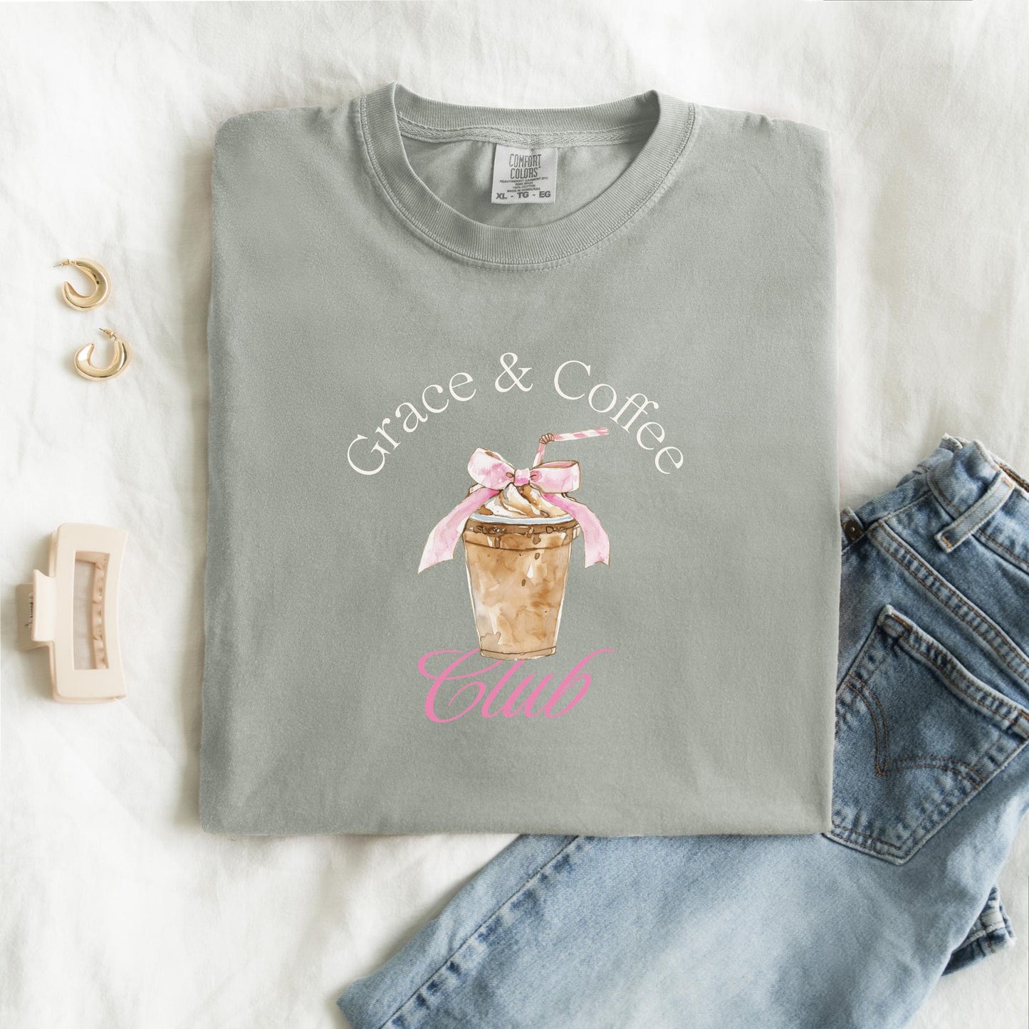 T-shirt with watercolor coffee cup design featuring pink bow and Grace & Coffee Club text
