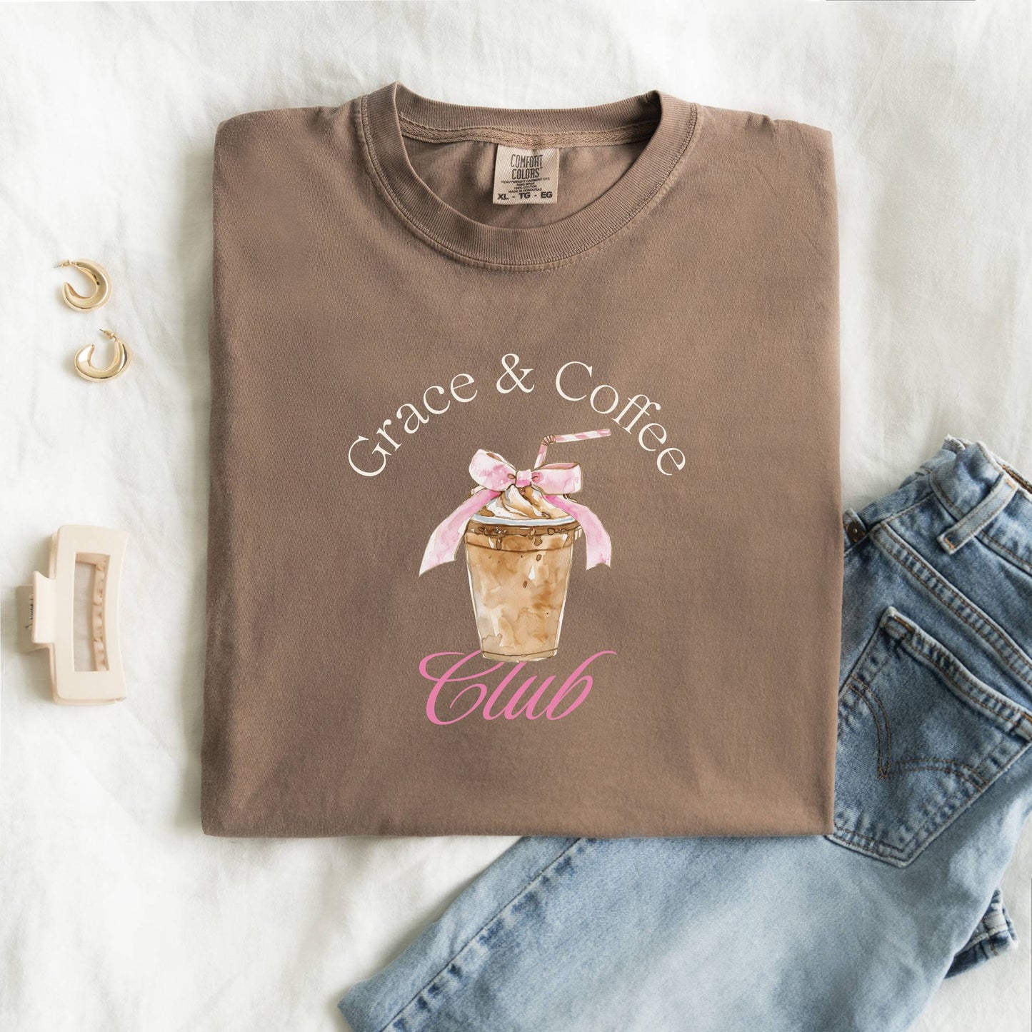 T-shirt with watercolor coffee cup design featuring pink bow and Grace & Coffee Club text