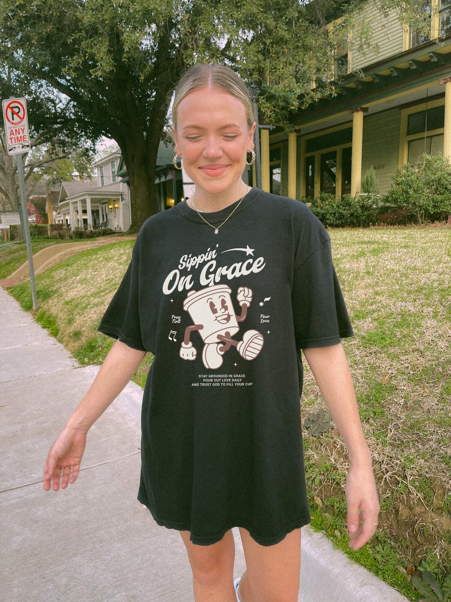 Christian t-shirt with cartoon coffee cup character and 'Sippin' On Grace' text in brown design