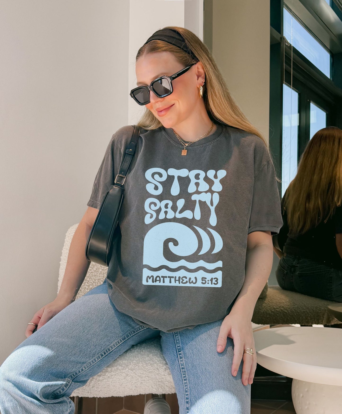 Christian t-shirt with 'Stay Salty' text and ocean wave design referencing Matthew 5:13