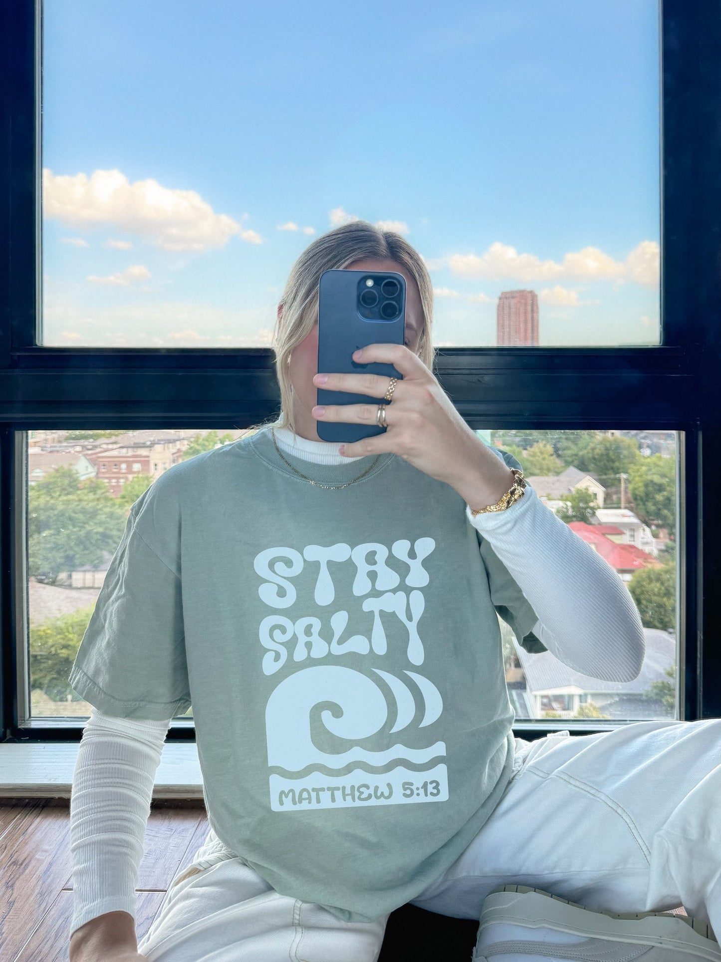 Christian t-shirt with 'Stay Salty' text and ocean wave design referencing Matthew 5:13