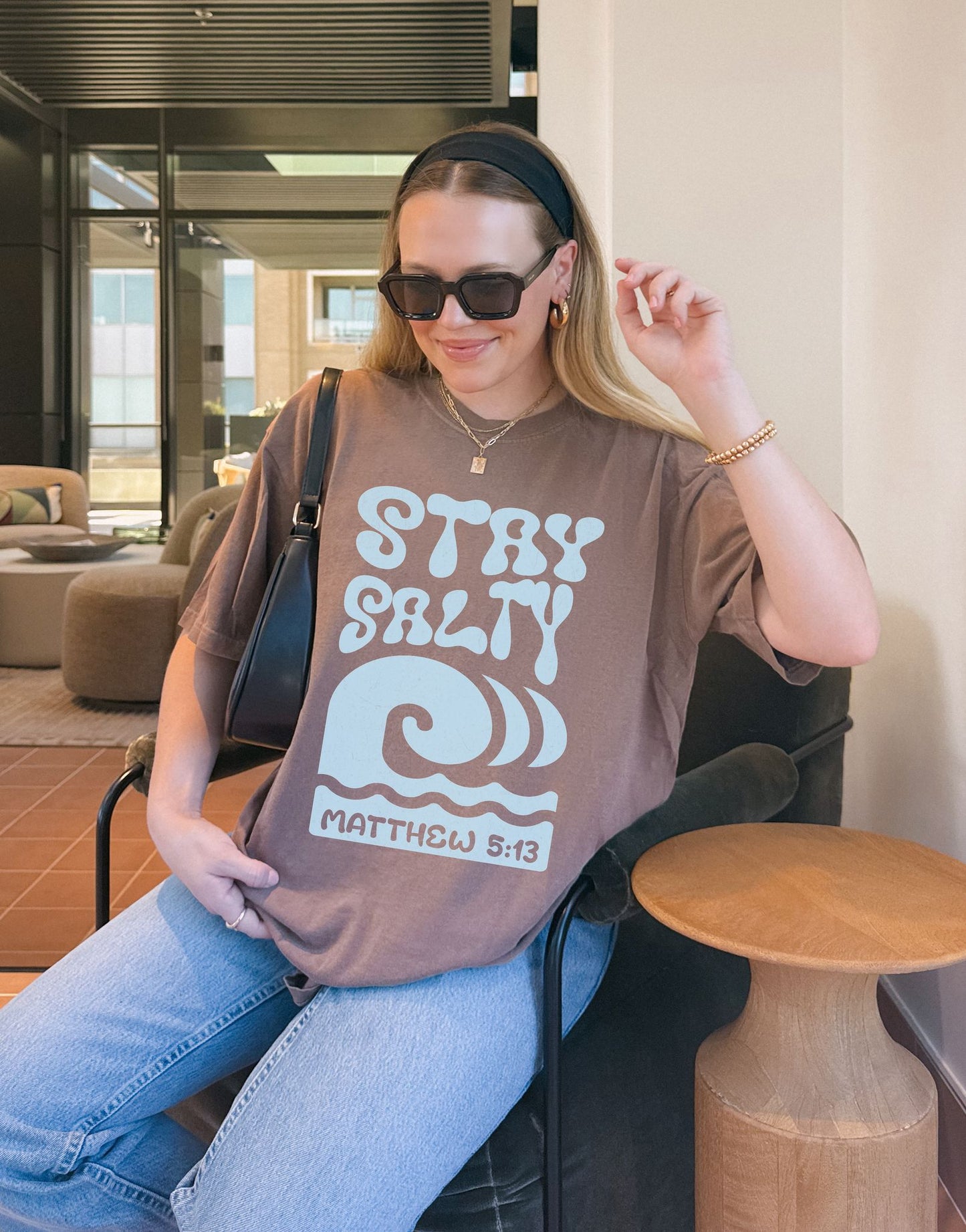 Christian t-shirt with 'Stay Salty' text and ocean wave design referencing Matthew 5:13