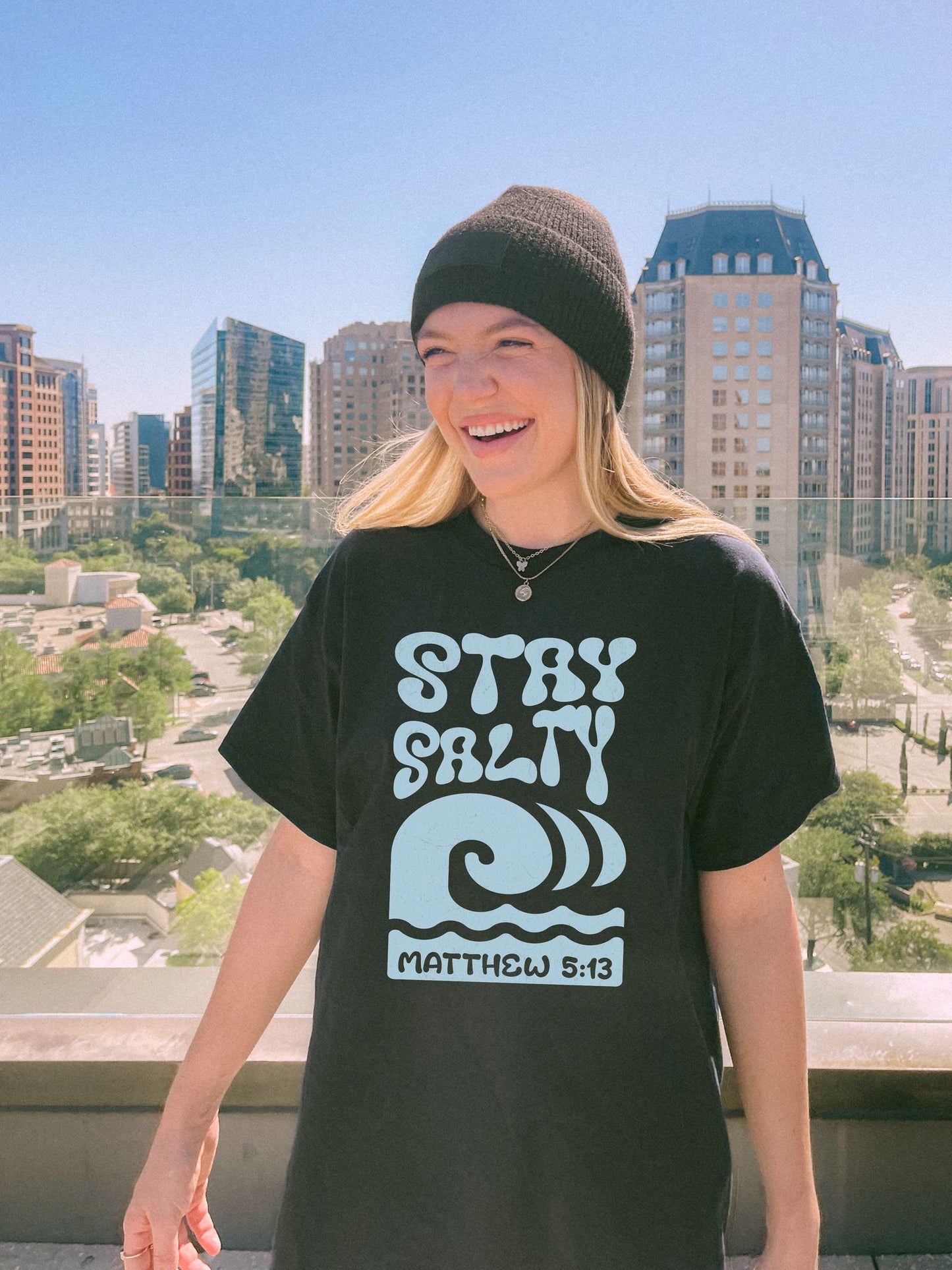 Christian t-shirt with 'Stay Salty' text and ocean wave design referencing Matthew 5:13