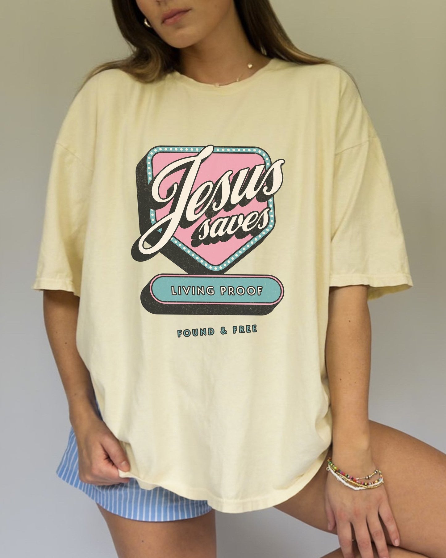 T-shirt with retro Jesus Saves design in pink and blue with distressed vintage styling