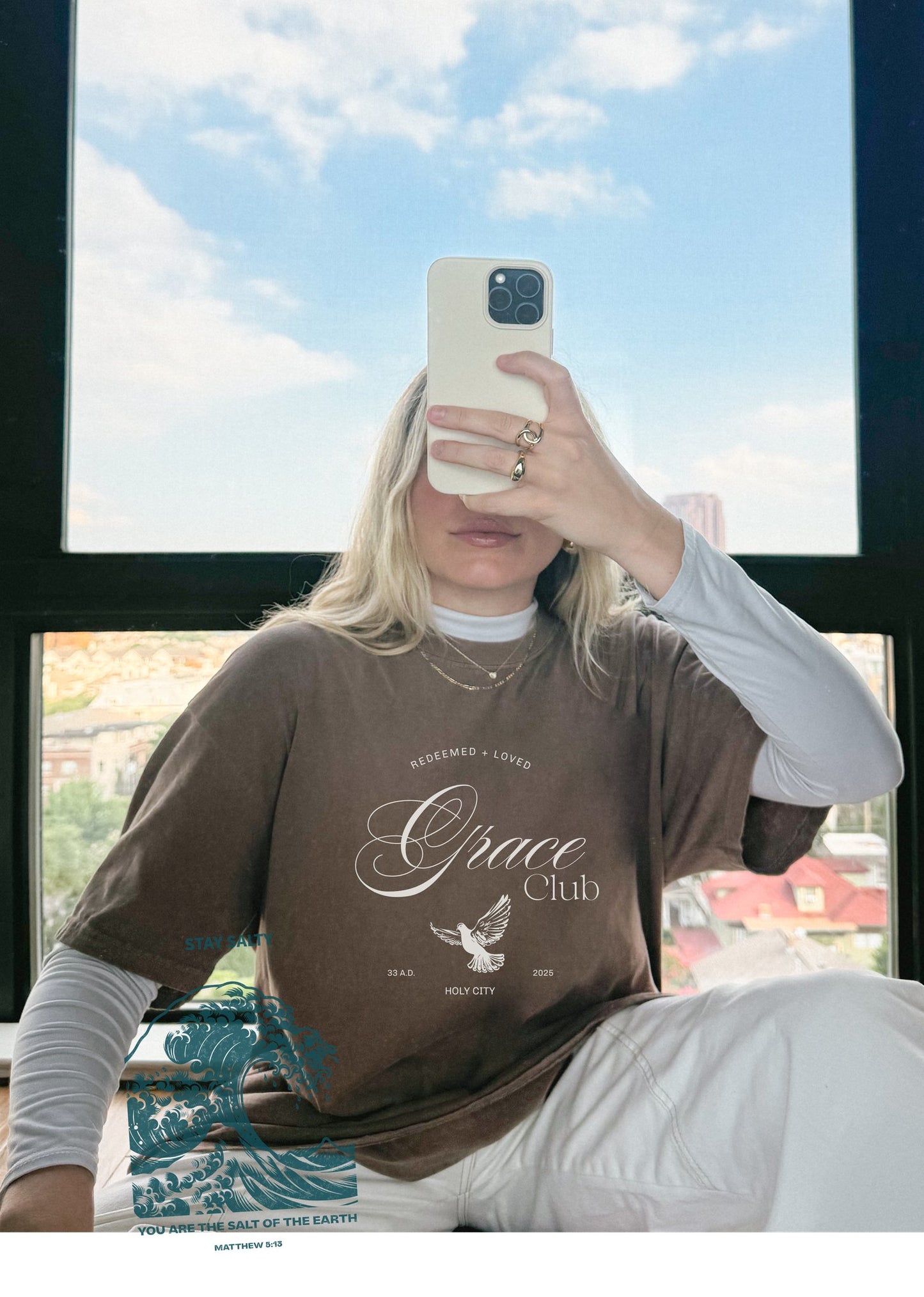 T-shirt with Grace Club text, dove symbol, and Redeemed + Loved message in elegant green design
