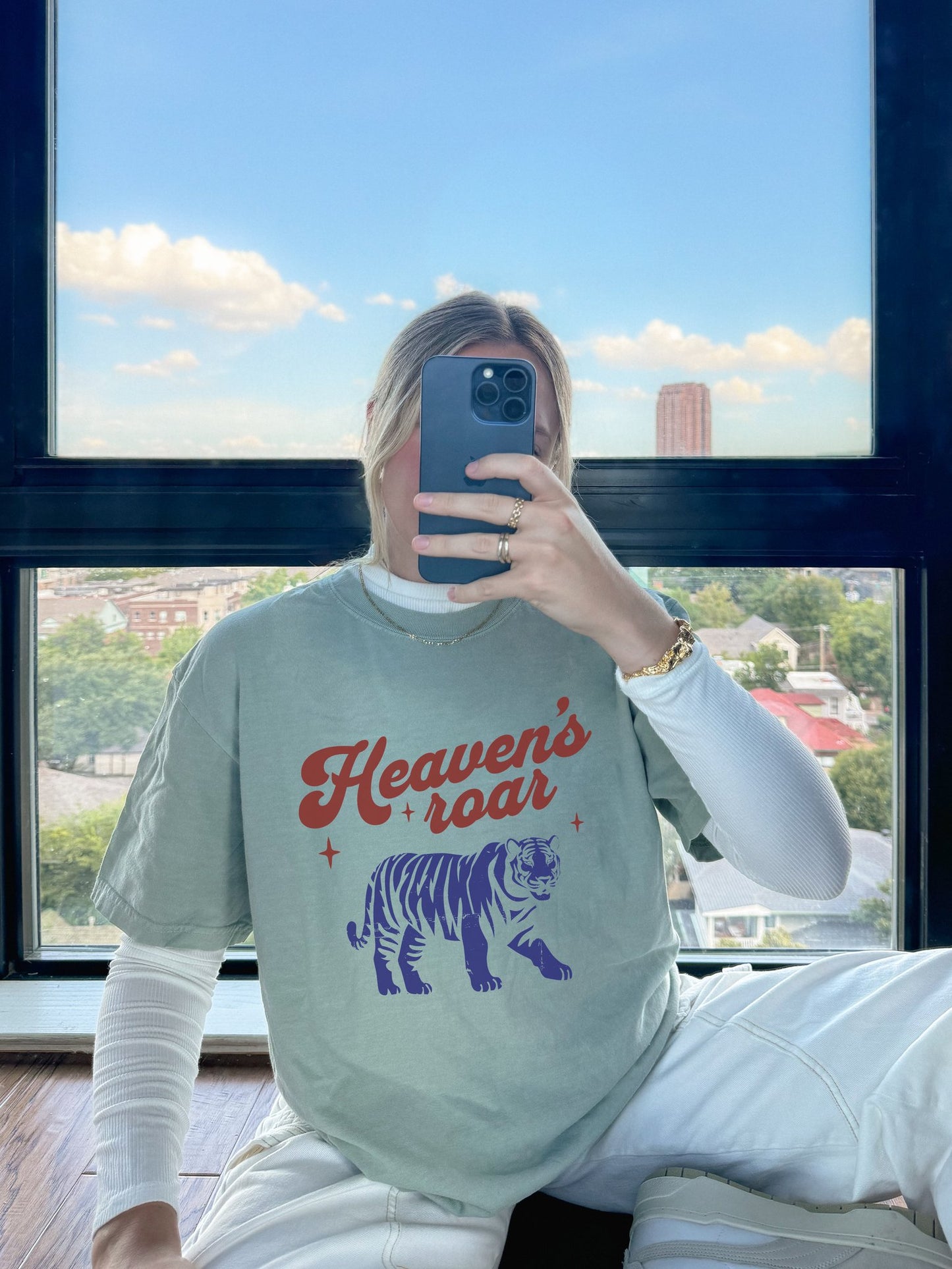 T-shirt with retro Heaven's roar text in red and blue tiger graphic design