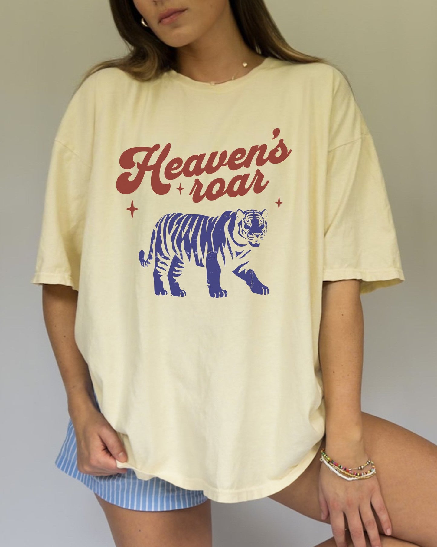 T-shirt with retro Heaven's roar text in red and blue tiger graphic design