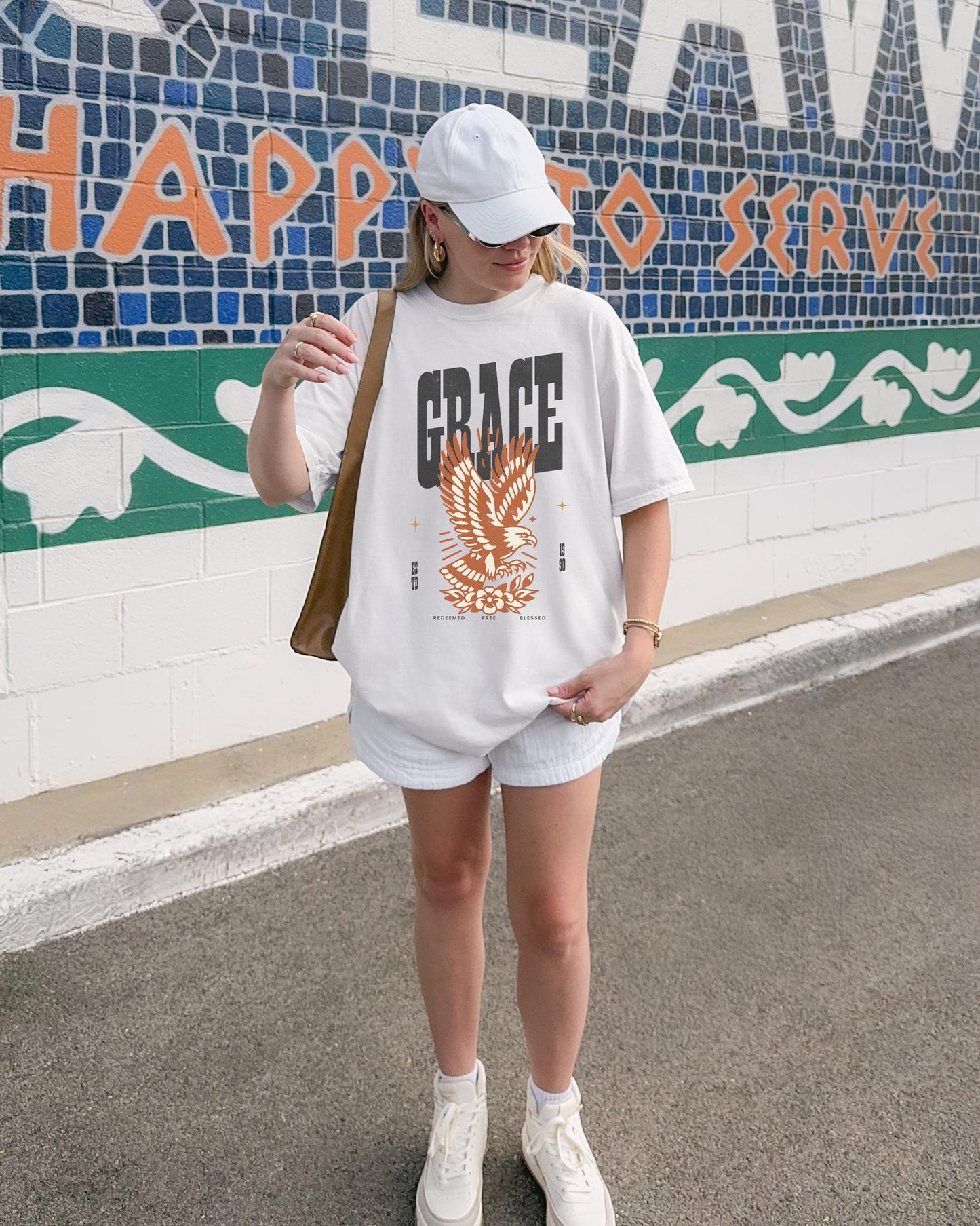 Christian t-shirt with vintage eagle design in orange and cream colors featuring Grace text and decorative elements