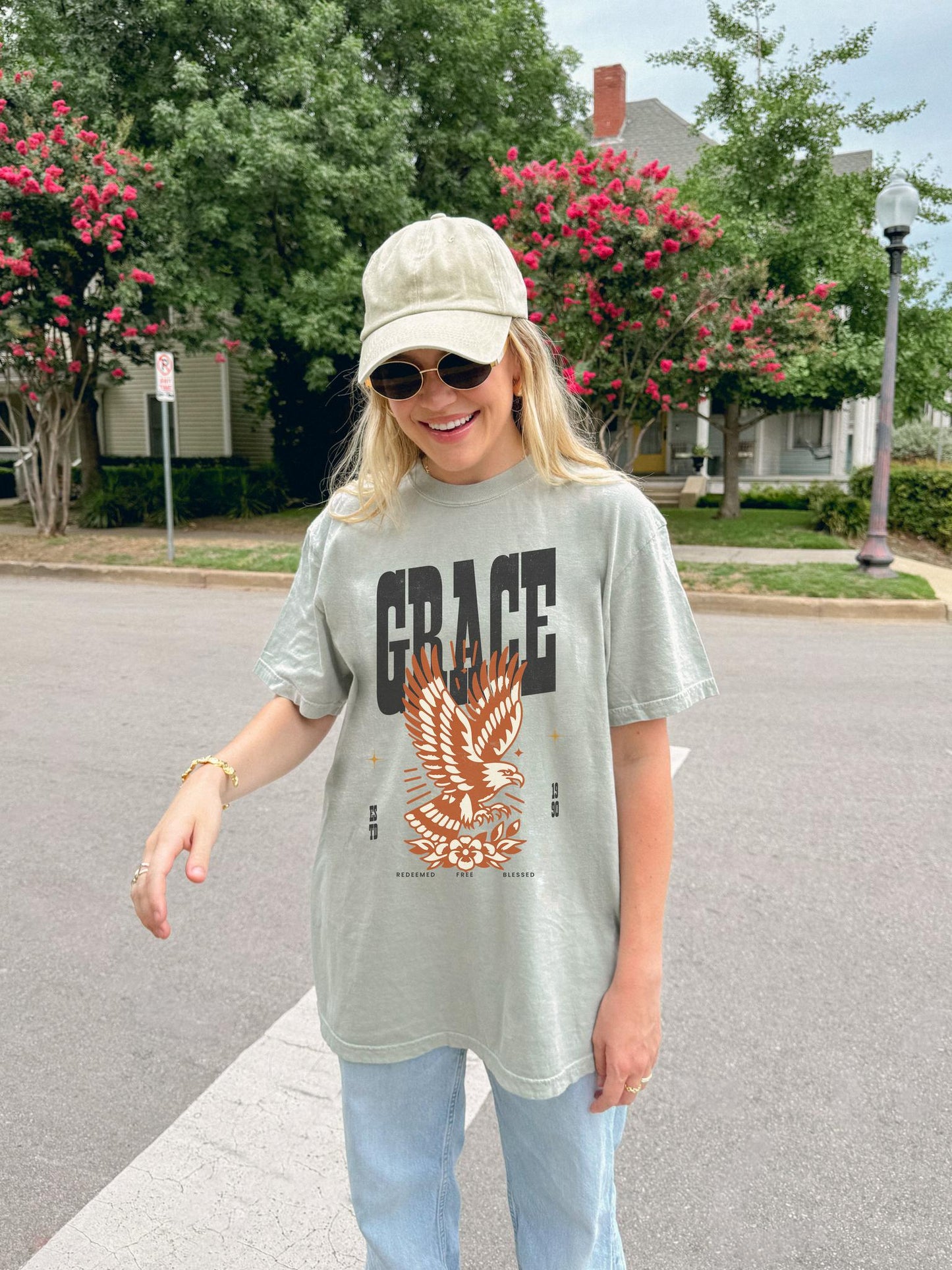 Christian t-shirt with vintage eagle design in orange and cream colors featuring Grace text and decorative elements