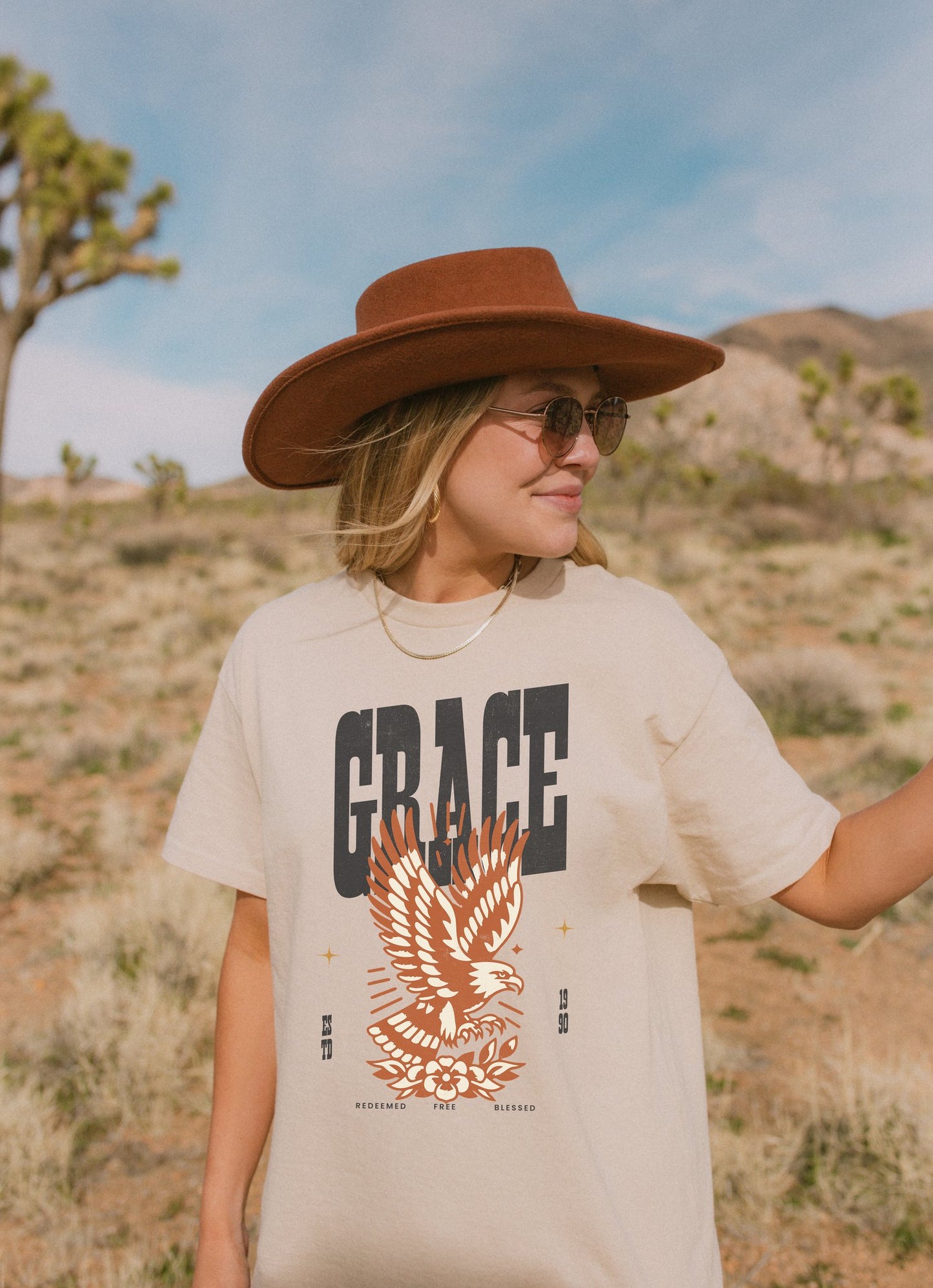 Christian t-shirt with vintage eagle design in orange and cream colors featuring Grace text and decorative elements