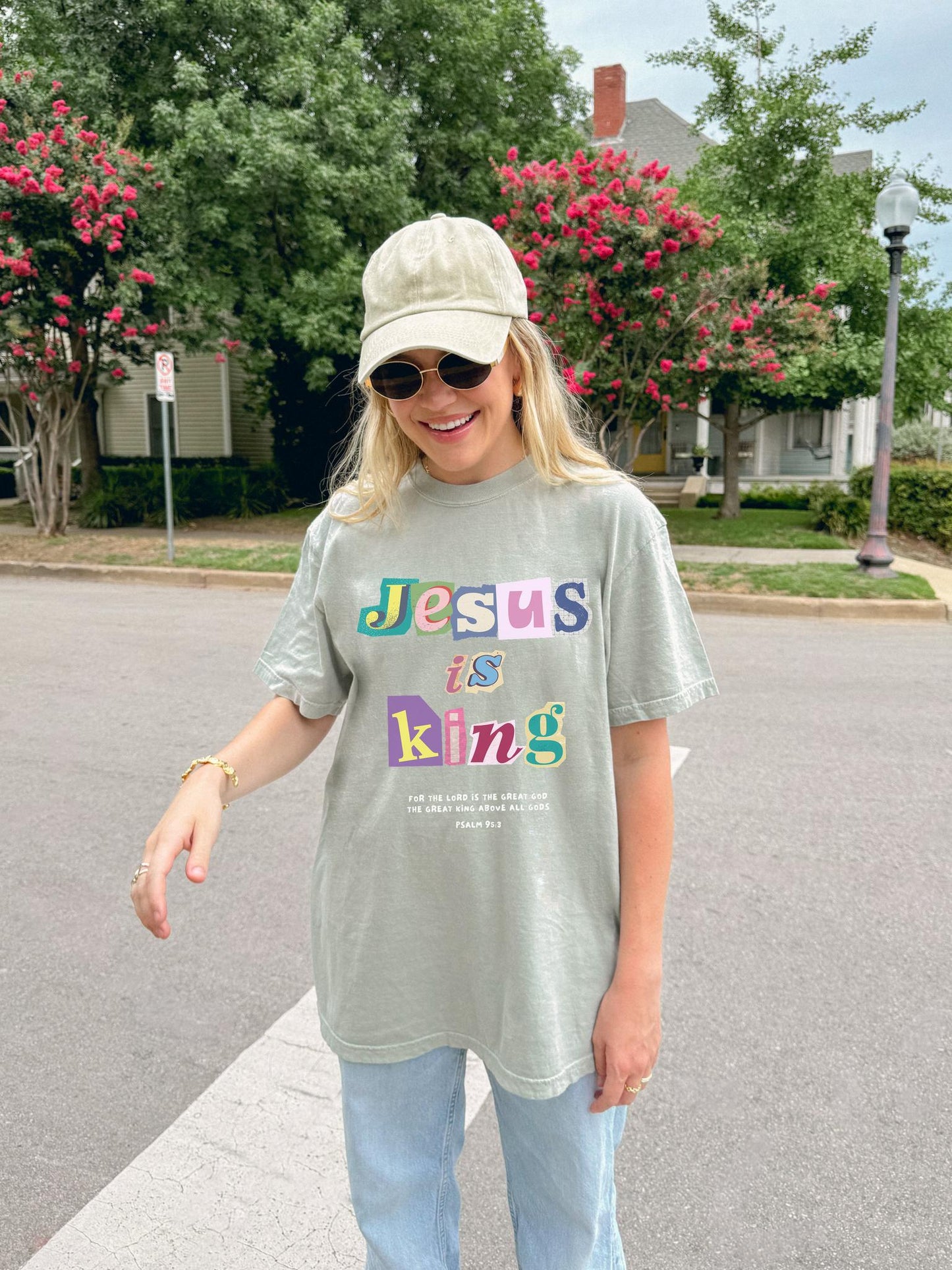 T-shirt with colorful block letters spelling Jesus is King and Psalm 95:3 Bible verse