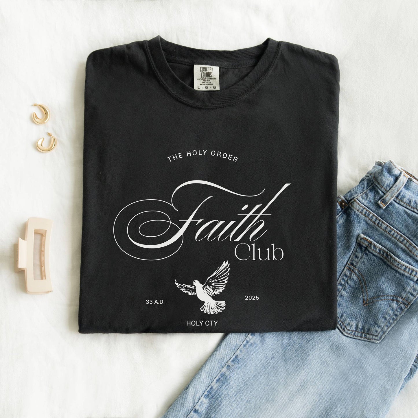 T-shirt with The Holy Order Faith Club text in elegant script with dove design and 33 A.D. Holy City details