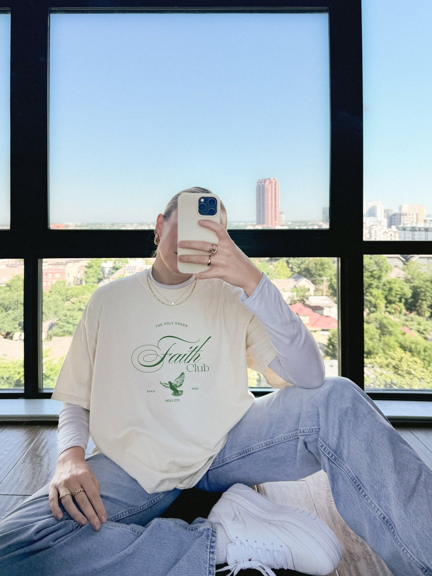 T-shirt with The Holy Order Faith Club text in elegant script with dove design and 33 A.D. Holy City details