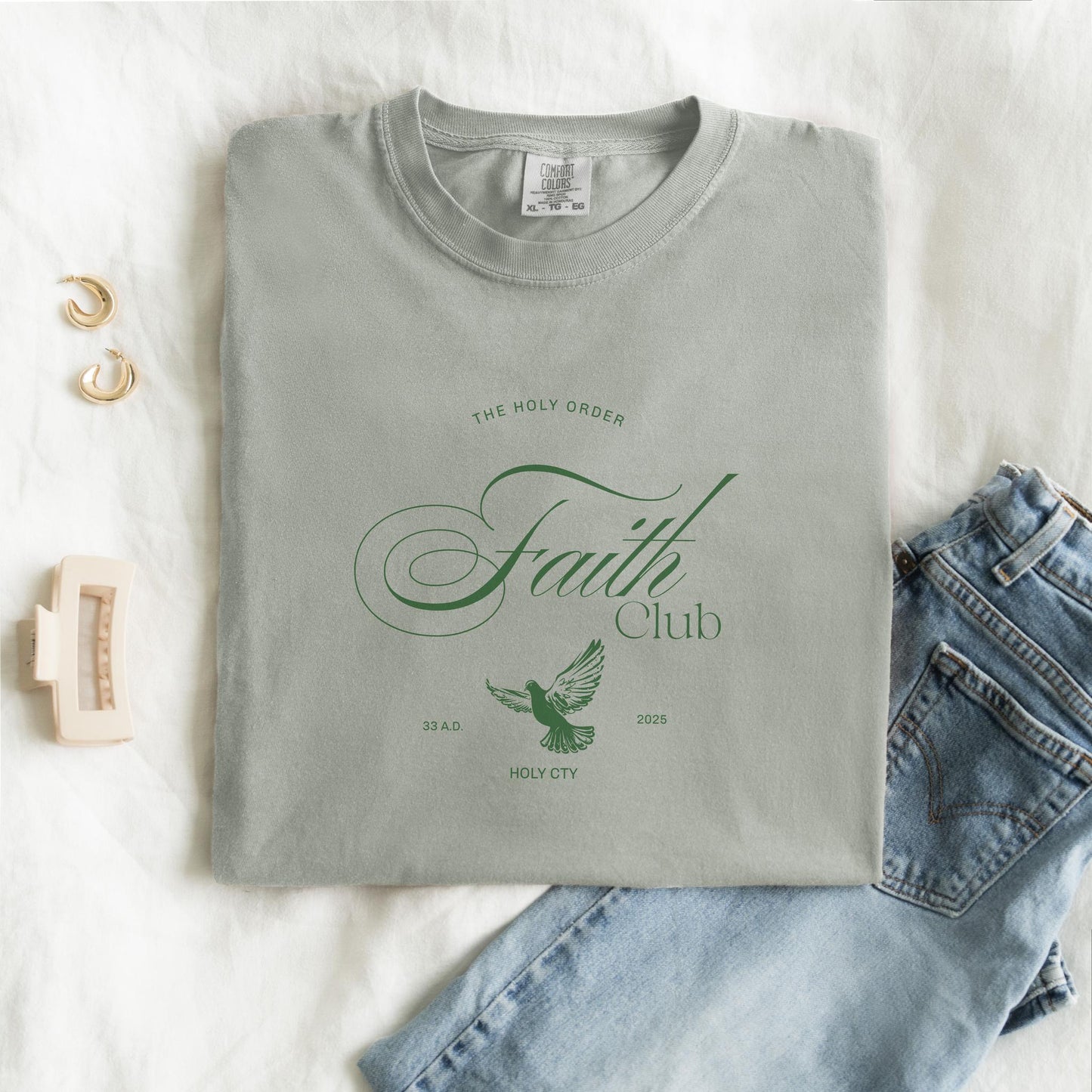 T-shirt with The Holy Order Faith Club text in elegant script with dove design and 33 A.D. Holy City details