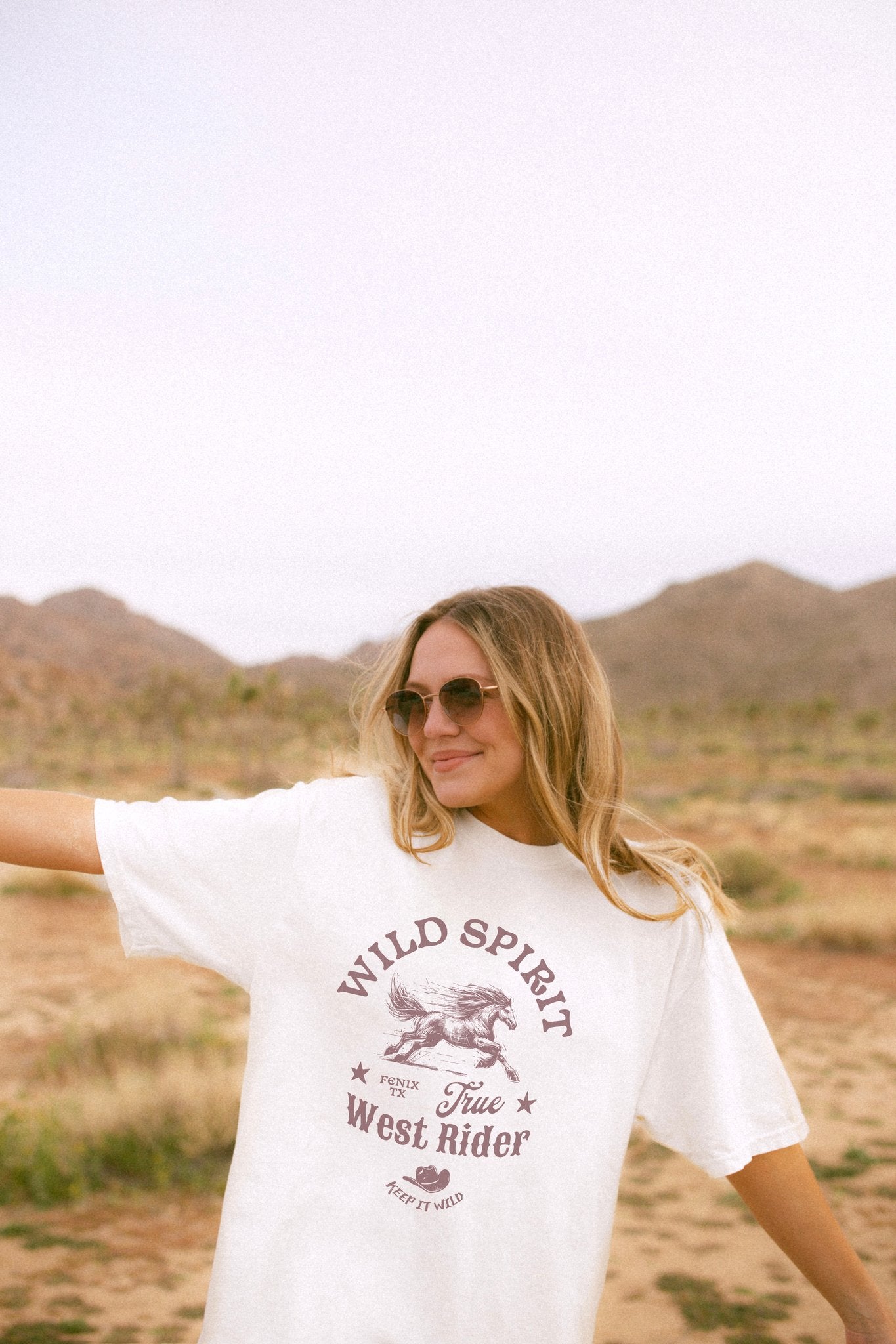Western t-shirt with galloping horse design, Fenix Texas text, and cowboy hat graphic in vintage style