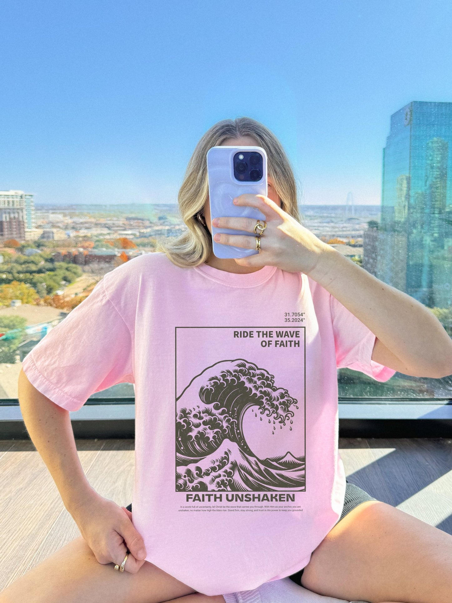 T-shirt with ocean wave design featuring 'Ride The Wave of Faith' and 'Faith Unshaken' text