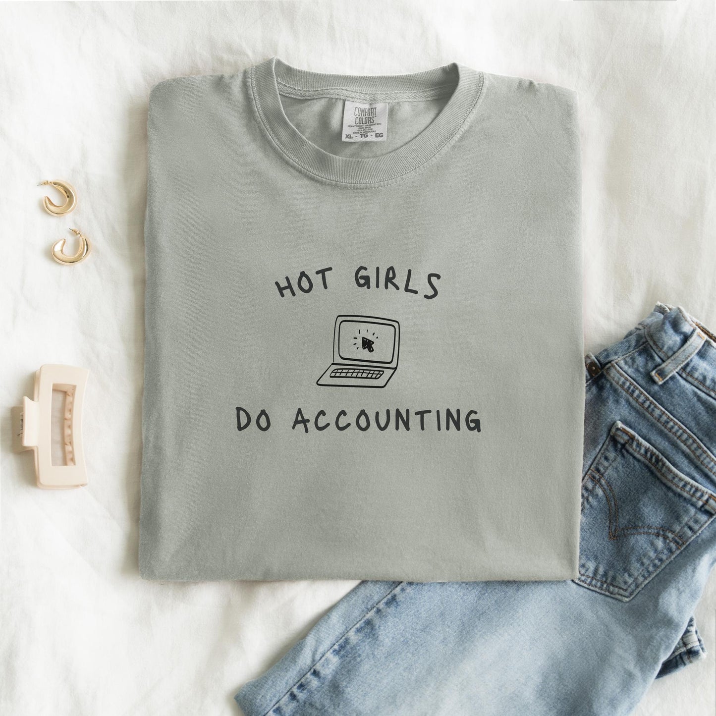T-shirt with 'Hot Girls Do Accounting' text and laptop computer graphic in black ink
