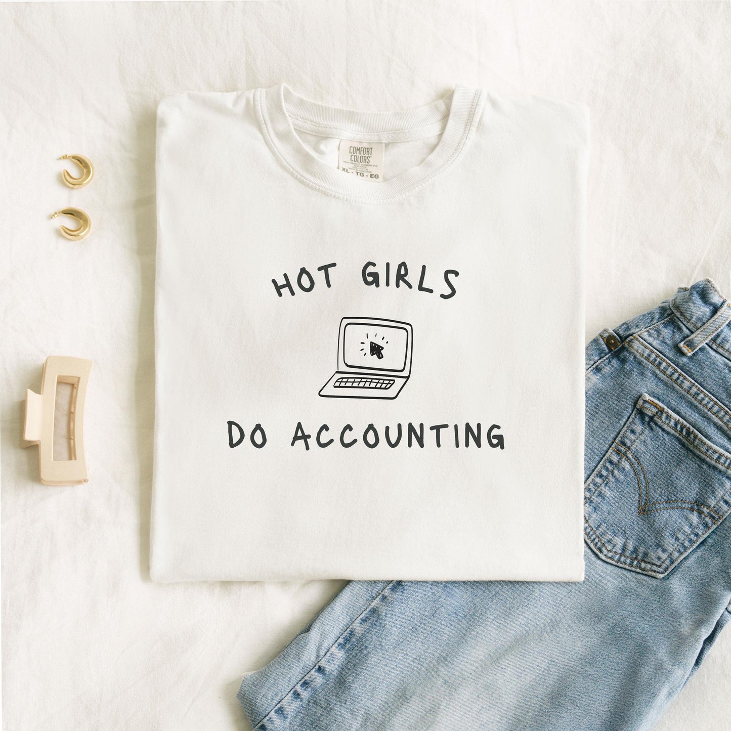 T-shirt with 'Hot Girls Do Accounting' text and laptop computer graphic in black ink