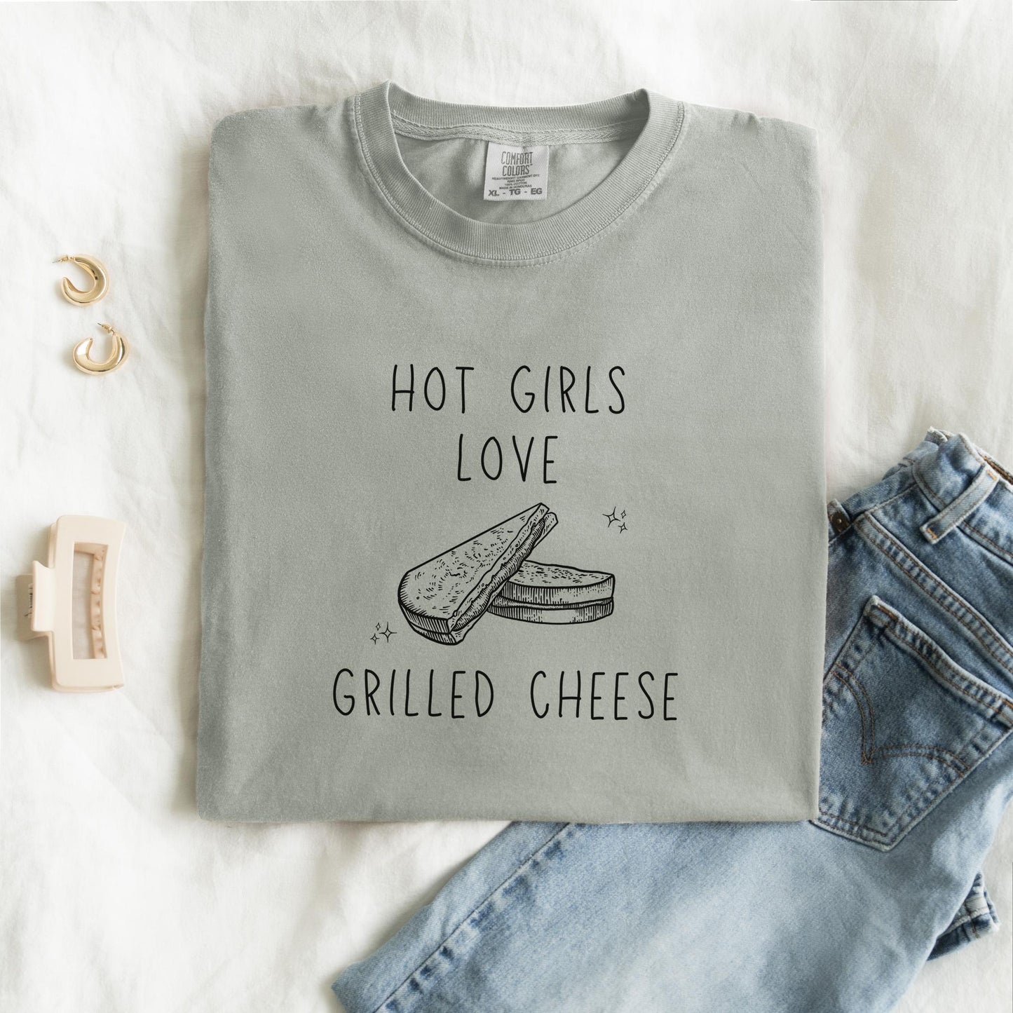 T-shirt with hand-drawn grilled cheese sandwich illustration and text reading Hot Girls Love Grilled Cheese