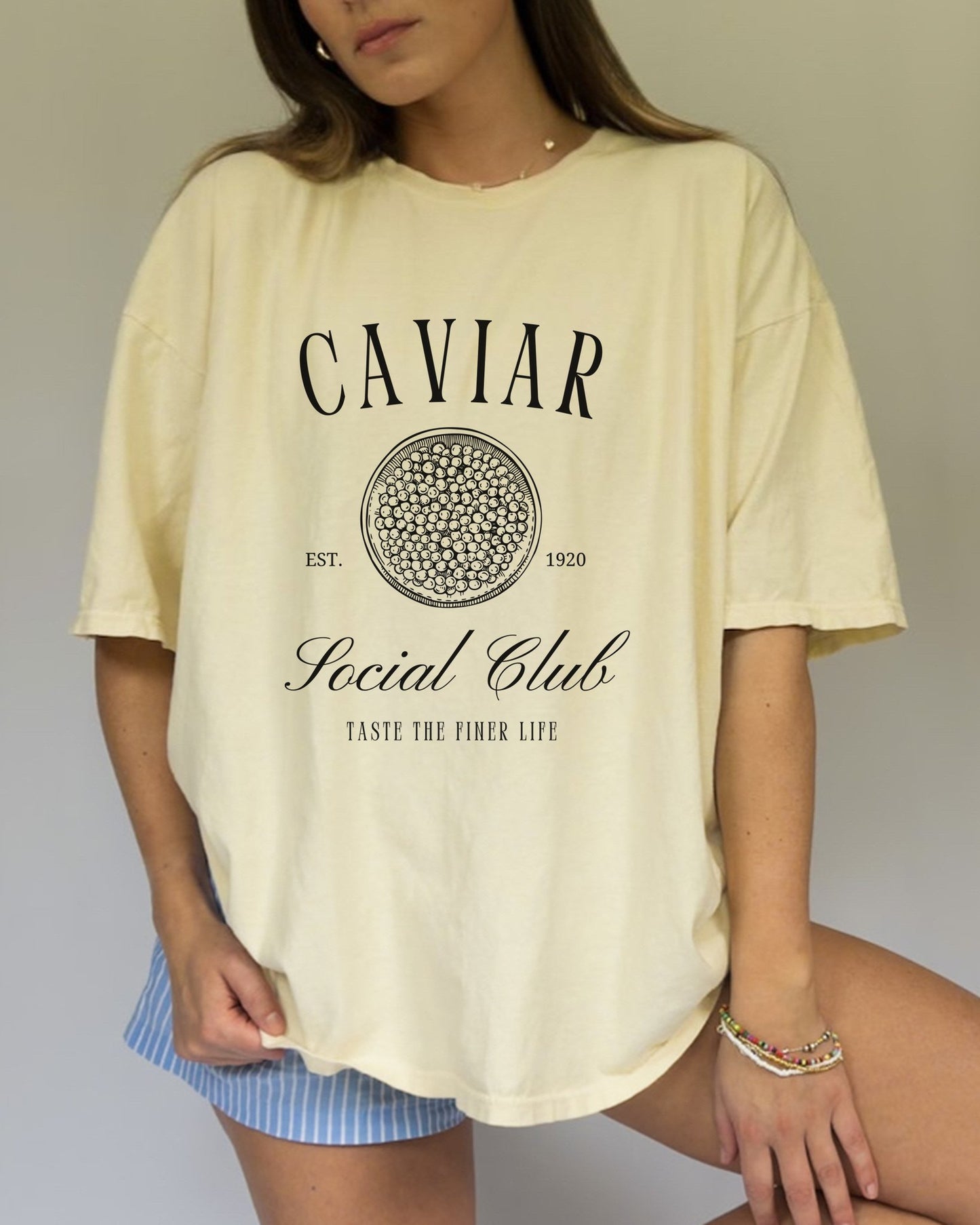 T-shirt with vintage caviar social club logo featuring caviar tin graphic and elegant typography