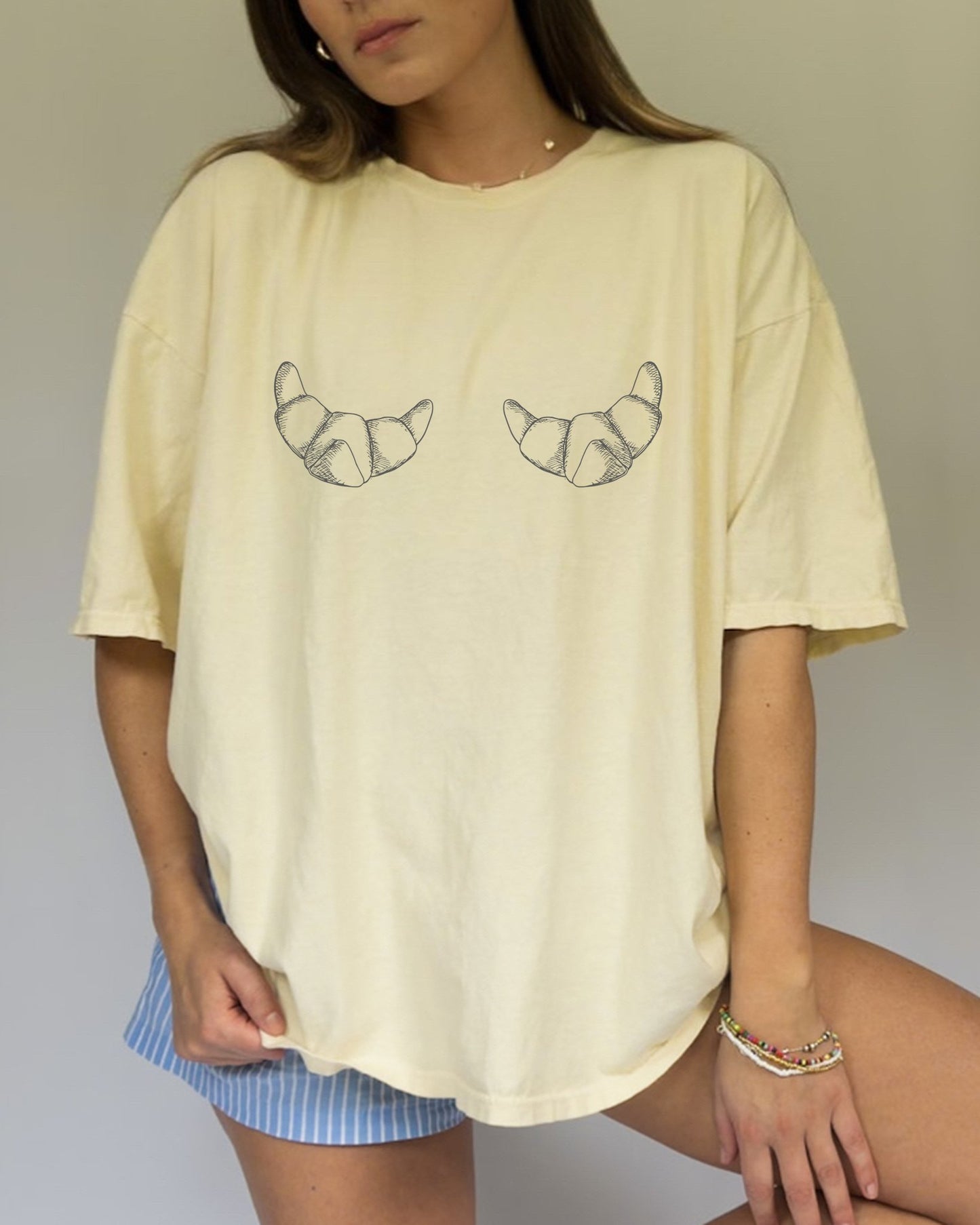 T-shirt with hand-drawn croissant illustrations featuring detailed pastry sketches