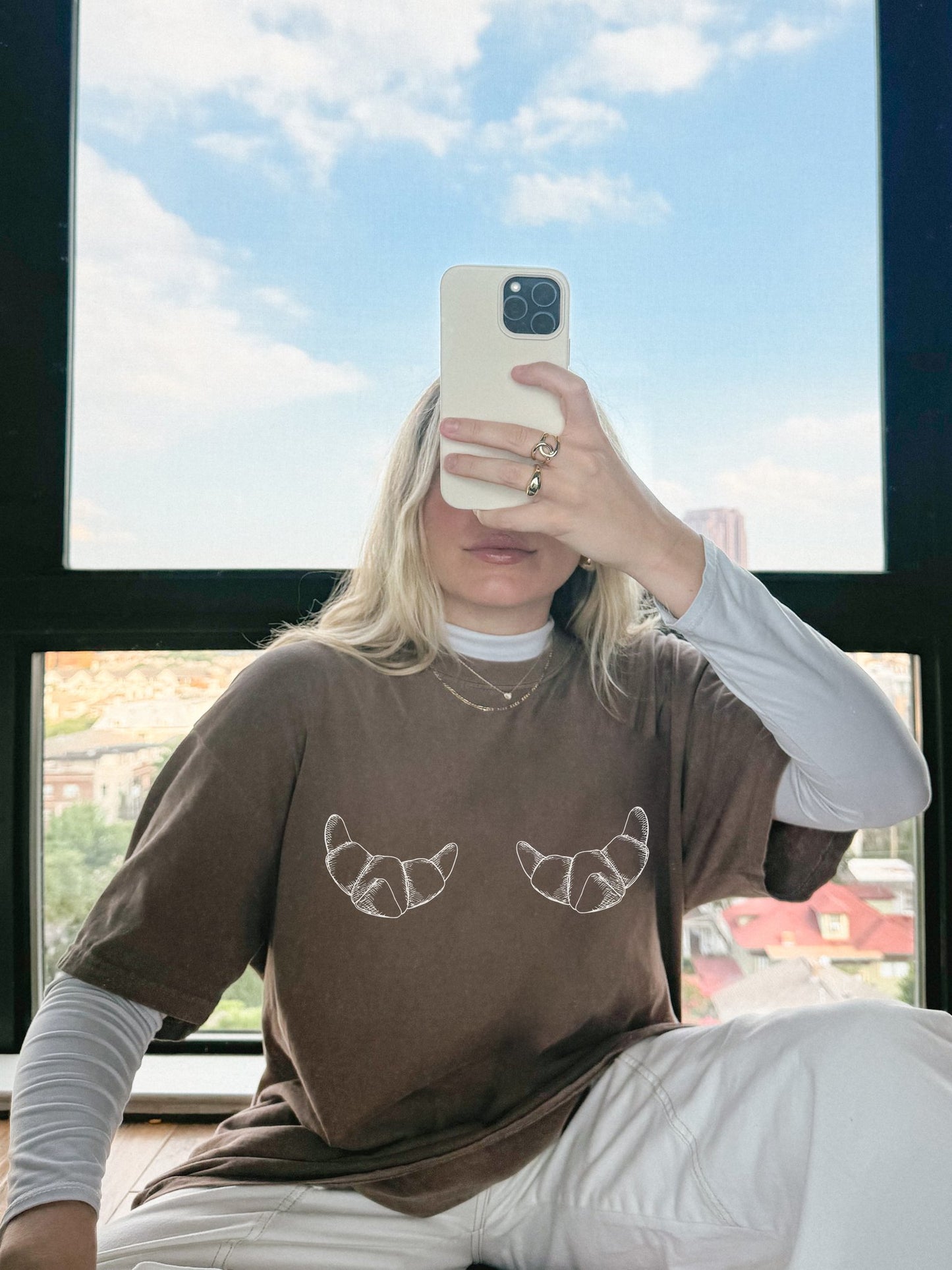 T-shirt with hand-drawn croissant illustrations featuring detailed pastry sketches