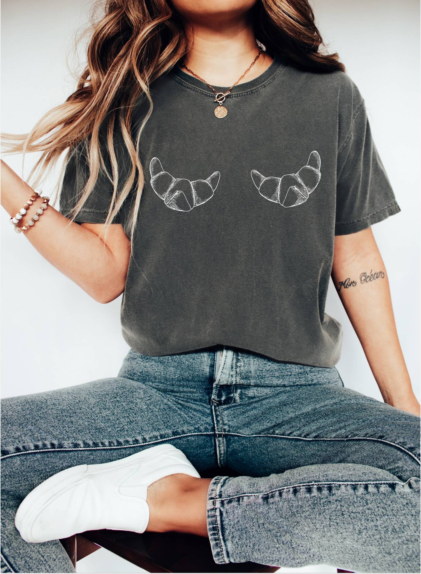 T-shirt with hand-drawn croissant illustrations featuring detailed pastry sketches