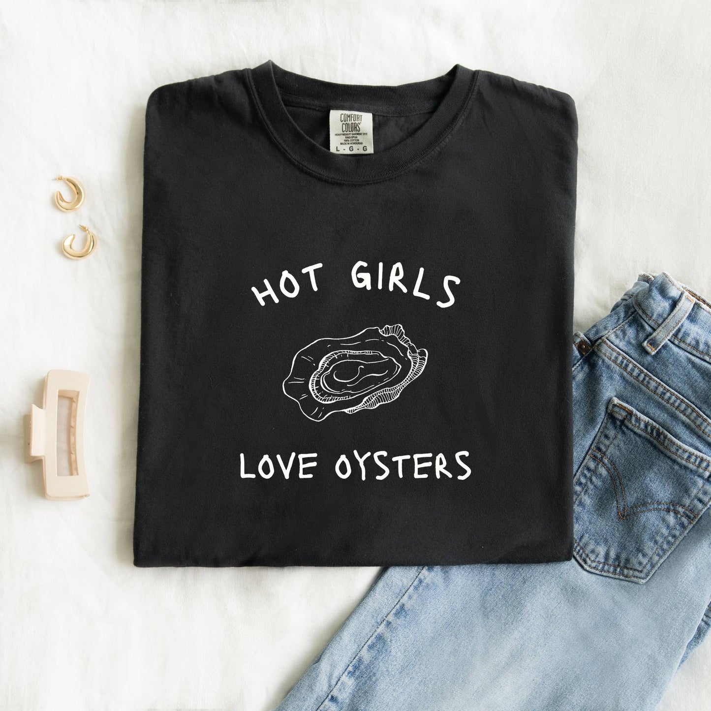 T-shirt with 'Hot Girls Love Oysters' text and hand-drawn black oyster shell illustration