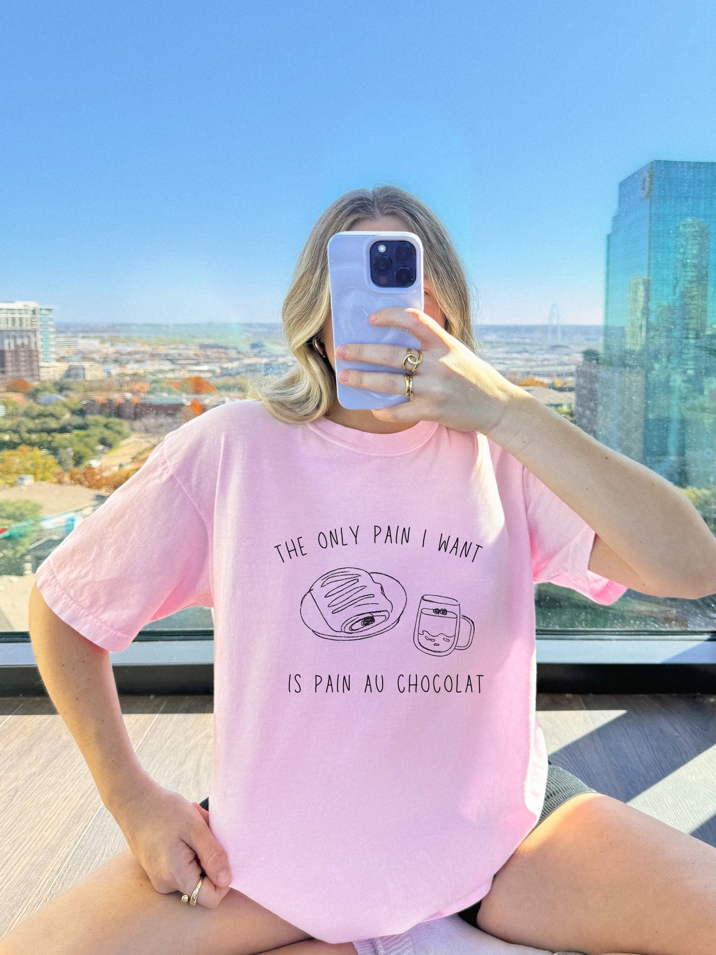 T-shirt with hand-drawn croissant and coffee cup illustration and funny baking text