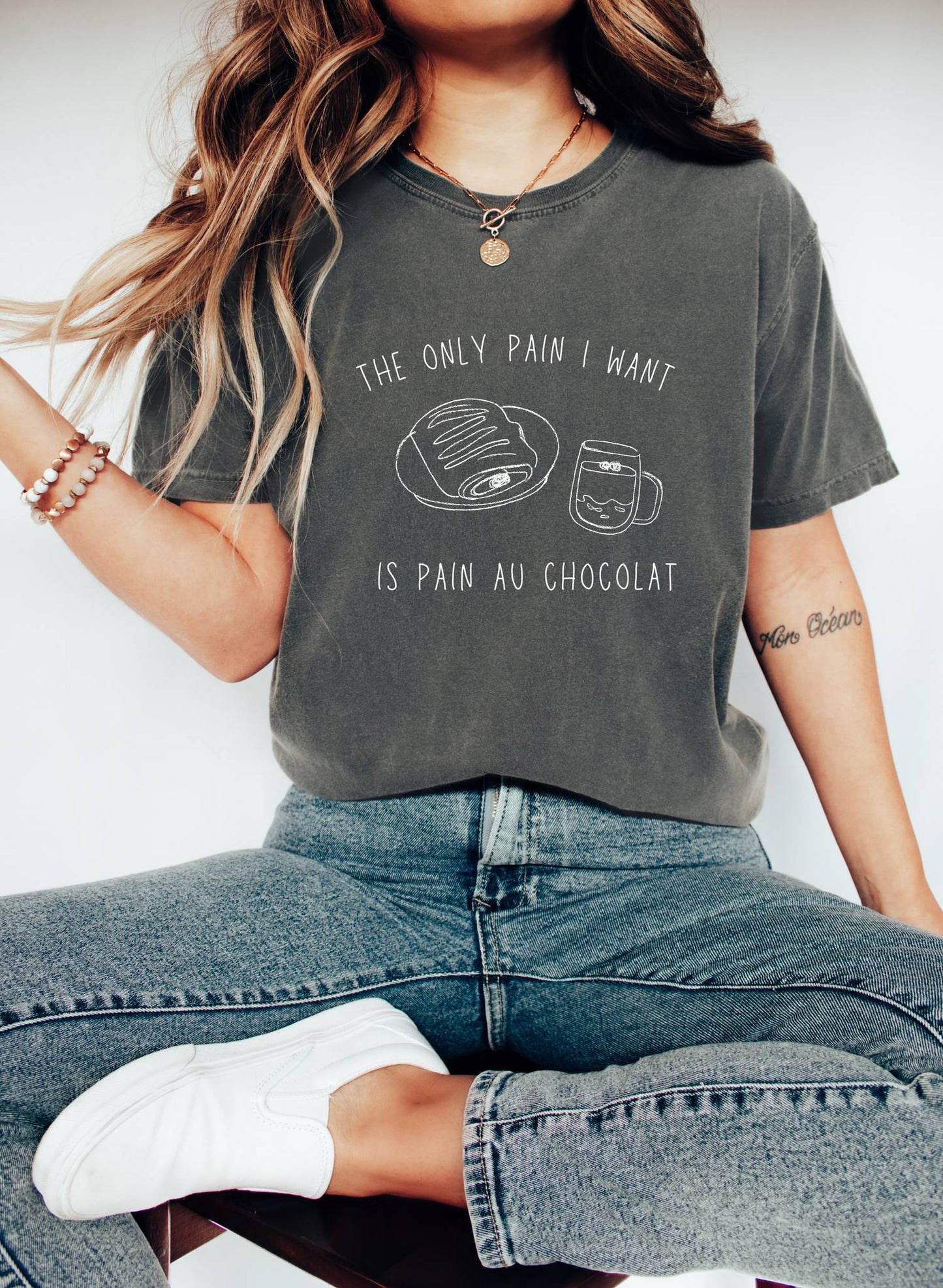 T-shirt with hand-drawn croissant and coffee cup illustration and funny baking text
