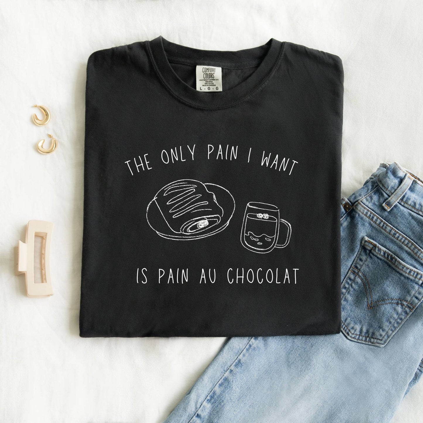 T-shirt with hand-drawn croissant and coffee cup illustration and funny baking text