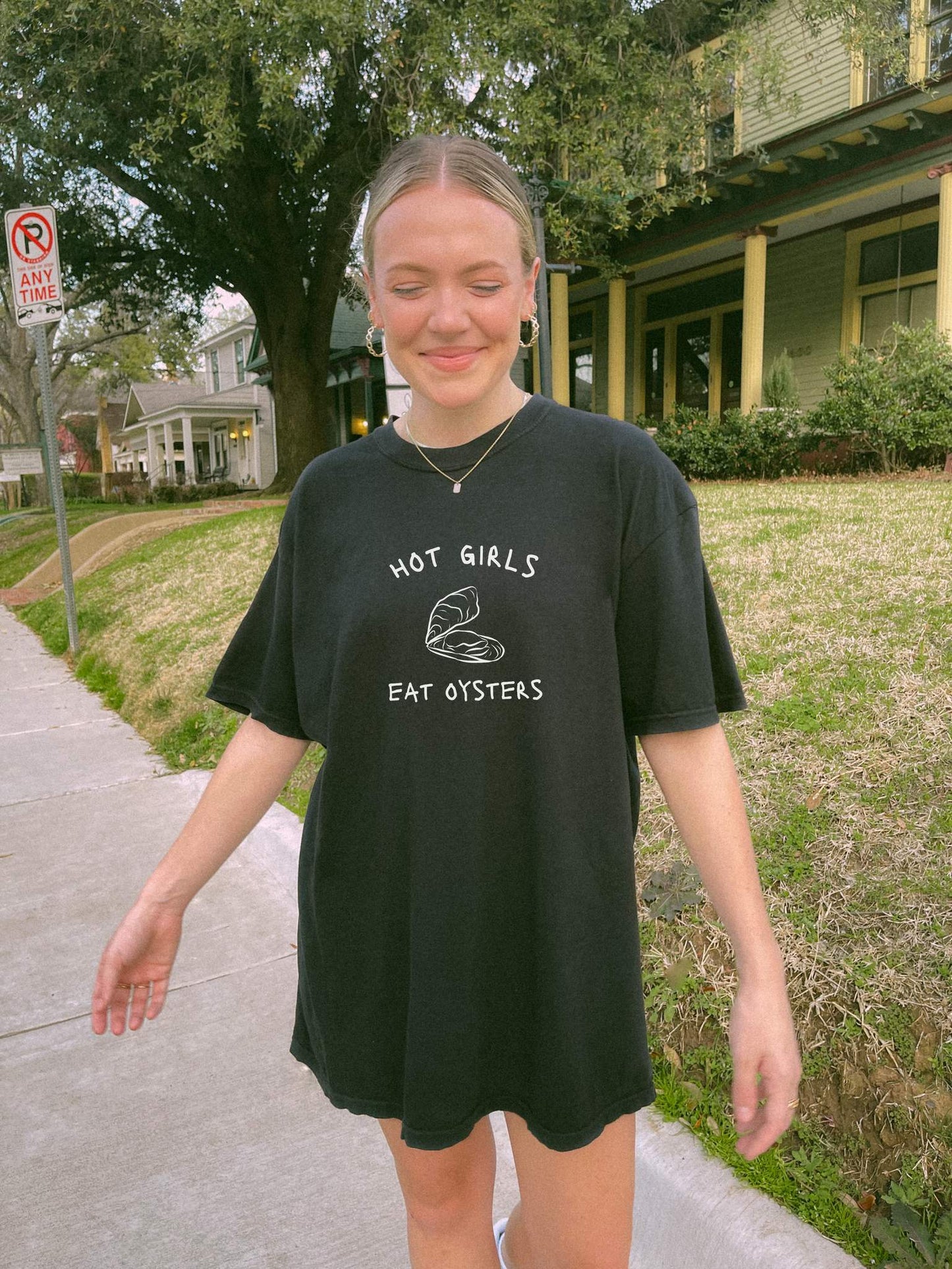 T-shirt with 'Hot Girls Eat Oysters' text and minimalist oyster shell illustration in blue tones